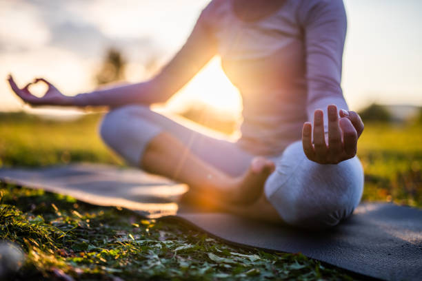 Person doing a fluid yoga pose in a calm, minimalist environment.